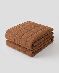 Metro Line Quilted Couch Cover Mat - folded studio